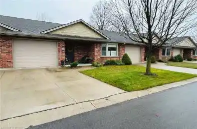 Ranch-style house with a front lawn and a garage