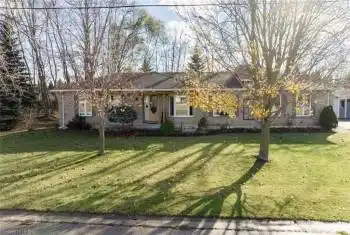 Ranch-style home featuring a front yard