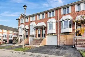 Townhome / multi-family property featuring a garage
