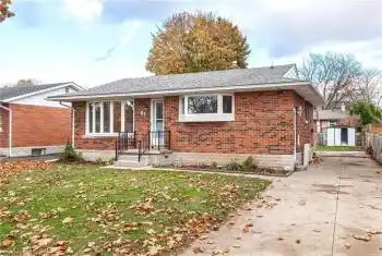 Single story home with a front lawn