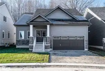 Craftsman-style house with a front lawn